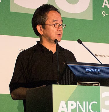 Akinori Maemura, JPNIC (and former APNIC EC Chair), speaks at APNIC 38.