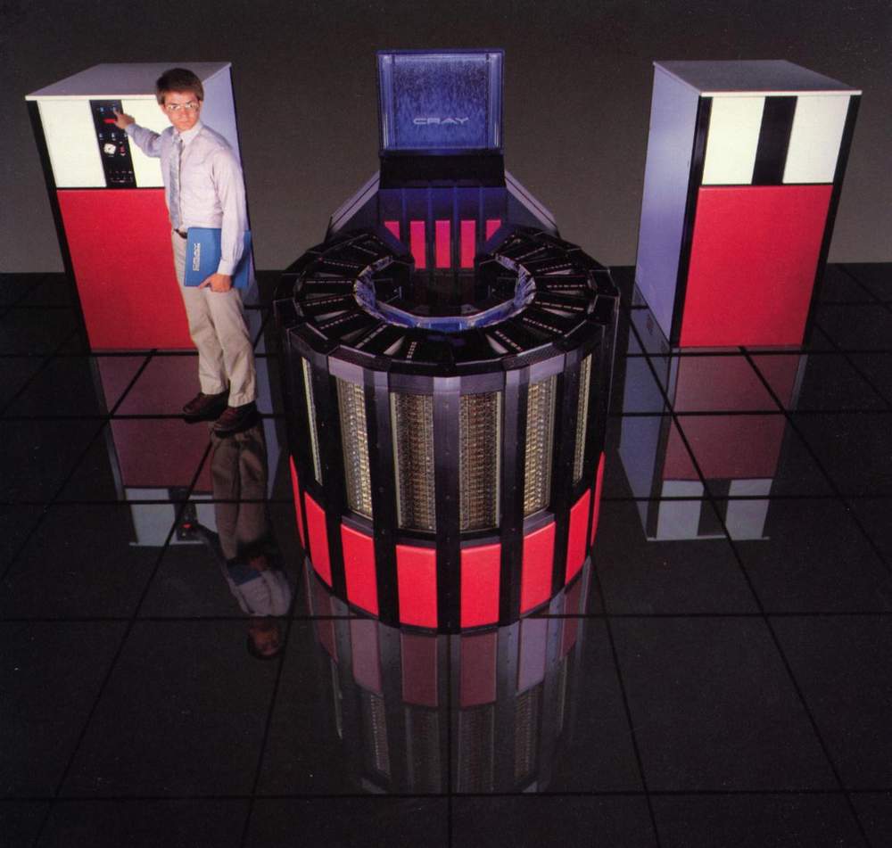 In an effort to reduce the size of the computer, circuitry was densely packed into the central unit (foreground). This resulted in significant heat loads that were managed by forcing the electrically inert Fluorinert liquid through the circuitry under pressure, and then cooling it using a waterfall cooler system (background). Image: <a href="http://www.craysupercomputers.com/cray2.html" target="_blank">Cray Supercomputers</a>
