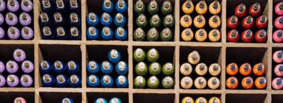 products on a shelf, grouped by colour