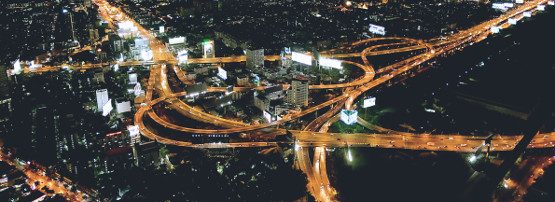 header image: aerial view of highway system at night