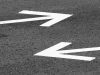 road arrows pointing in opposite directions