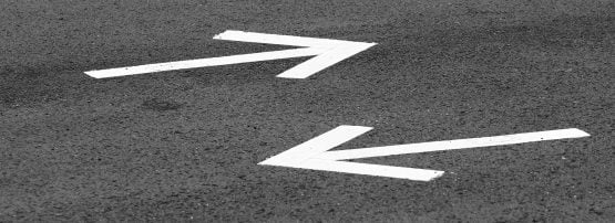 road arrows pointing in opposite directions