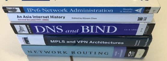 Networking books stacked