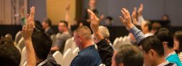 People voting on a policy proposal.