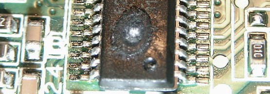 A burned out DIP packaged integrated circuit
