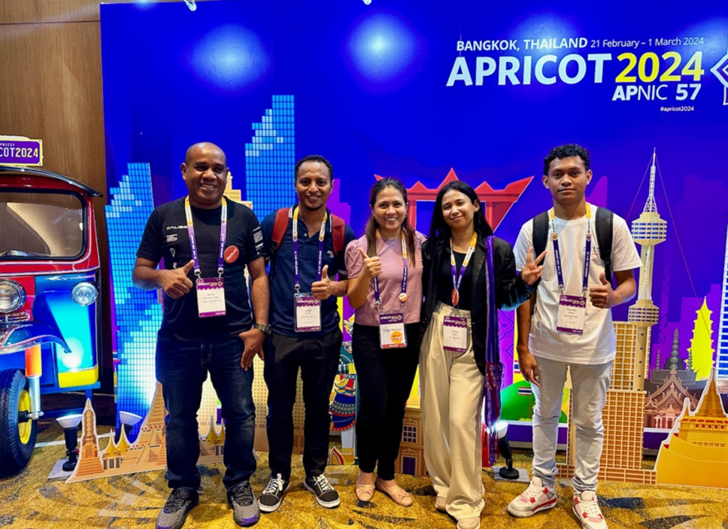 Picture of (from left): Abilio Caldas (APNIC Foundation), Jorge Soares (Sacomtel),  Shane, Thalia Mota (TIC Timor), and Tarciso Tilman (Sacomtel) during the APRICOT 2024 conference.