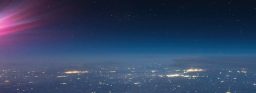 A view of a city lit up at night time.