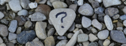 A question mark drawn on a rock.