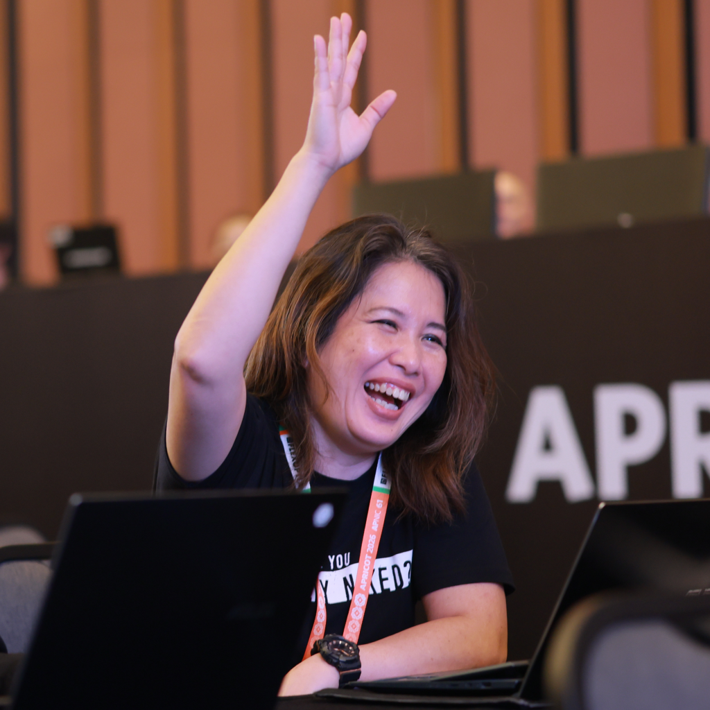 Figure 1  — An OPM-simulation participant raises their hand in support of the policy proposal. 
