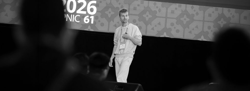 Thomas Holterbach introduces bgproutes.io during the APRICOT 2026 APRICOT Peering Forum 2 .