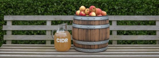 Image of a barrel of apples next to a jug of CIDR